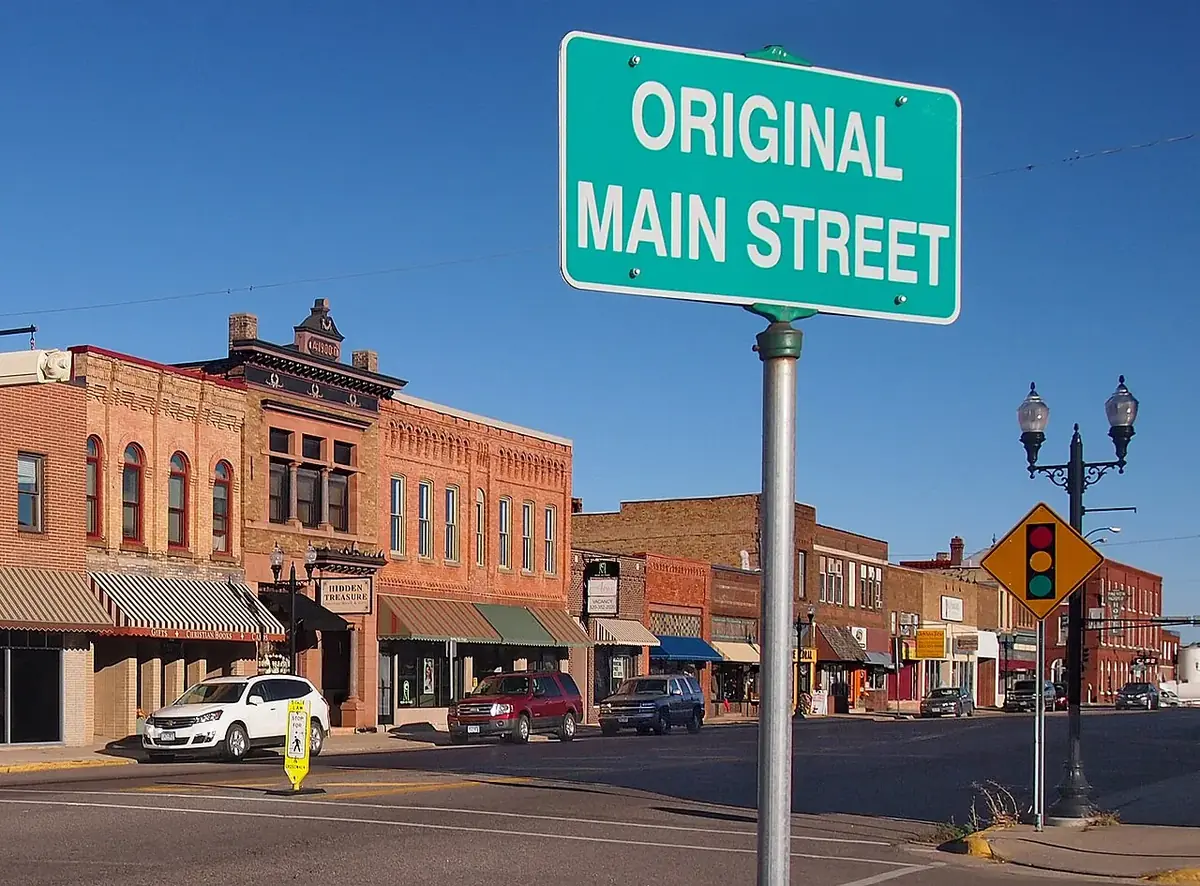 Original Main Street sign above historic downtown storefronts in Sauk Centre, Minnesota